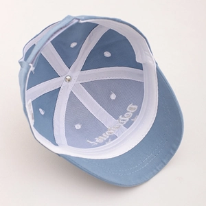 Detailed interior of a kids baseball cap showing reinforced seams and sweatband comfort