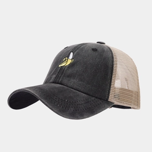 Detail of vintage grey baseball cap with banana embroidery and breathable beige mesh