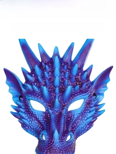 Macro detail of the 3D dragon mask showing blue-purple scales and textured surface spikes