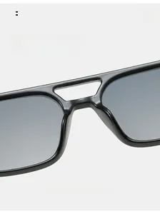Detail of hollow double-bridge frame and integrated comfortable nose pads on black sunglasses