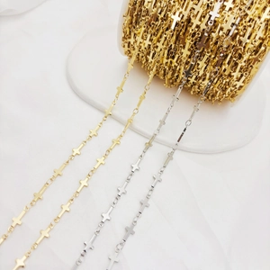 Detailed view of DIY jewelry chains with cross links in gold and silver metal finishes