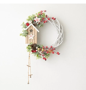 Detailed Christmas wreath with white vine base, pine cones, birdhouse and red berries