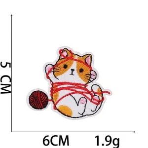 Detailed cat embroidery patch featuring orange cat with red yarn ball, 5x6cm size