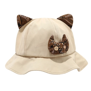 Beige kids canvas bucket hat with cat ears and vintage paisley cat patch detail