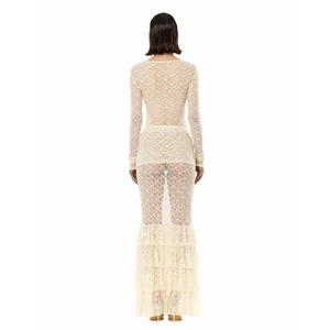 Detail view of beige lace maxi dress featuring back cutout and layered fishtail hem