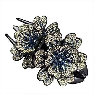 Pince à cheveux élégante triple fleur avec strass bleus et dorés champagne scintillants