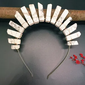 Detailed view of handcrafted crystal crown headband with white stone texture on metal band