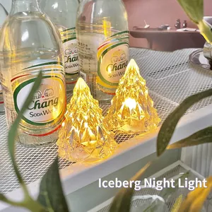 Iceberg crystal night light with warm yellow glow for minimalist bedroom atmosphere