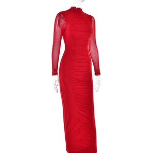 Detail of red long sleeve mesh dress with gathered ruched design and slim fit silhouette