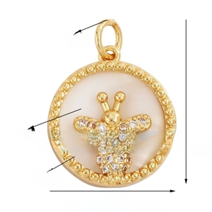 Macro shot of 16mm gold bee charm with shell inlay and cubic zirconia details