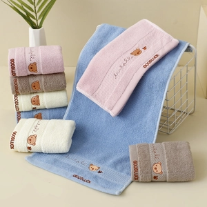 Detail of soft 32-strand cotton towels with cute bear embroidery and Goodluck text