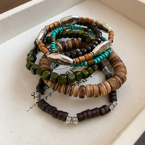 Bohemian 6-piece stacked bracelet set with irregular wooden beads and ethnic metal tubes