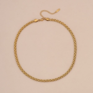 Detail of gold layered herringbone and curb chain necklaces with lobster clasp closure