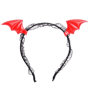 Detail of Halloween bat wing headband with red glossy finish and black lace trim