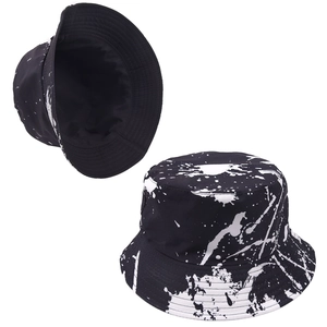 Ink splash print bucket hat featuring black and white graffiti design and flat top style