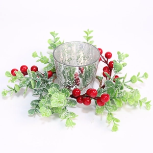 Christmas candle ring with red berries and snowy eucalyptus around silver glass holder