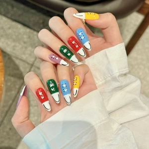 Extra long almond press-on nails with colorful hand-painted canvas shoe sneaker design