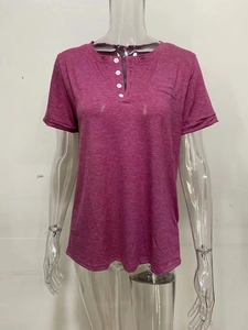 Close-up of V-neck dark purple knit t-shirt featuring a white buttoned henley neckline