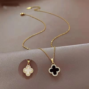 Elegant 18K gold double-sided clover necklace with black and white shell and zircons