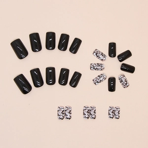 Glossy black and silver cracked marble press-on nails with long square shape design