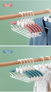 Detail of adjustable baby hangers showing retractable arms in blue and red colors