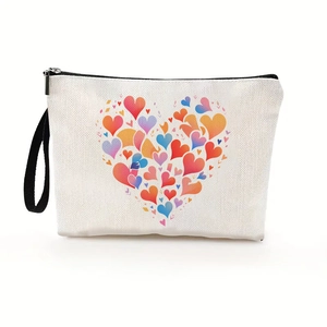 Portable heart print toiletry bag in cream canvas with colorful patterns and wrist strap