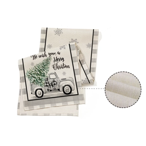 Christmas table runner with vintage truck and snowflake patterns on beige linen fabric