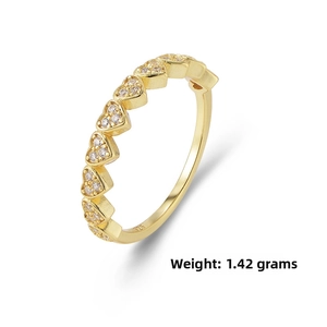 Macro shot of gold-plated S925 silver heart ring with zircon stones and 925 hallmark
