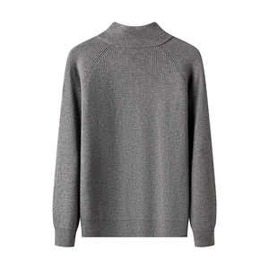 Macro detail of dark grey rib-knit texture and stand collar on men's business jacket