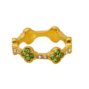 Close-up of 18K gold ring featuring green clover flower and sparkling white crystals
