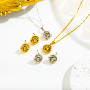 Elegant rose gold and silver floral jewelry set with necklaces and crystal stud earrings