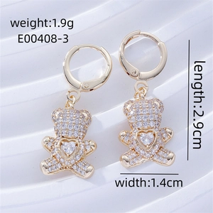 Detail view of gold bear earrings with zircon stones showing dimensions 2.9cm by 1.4cm