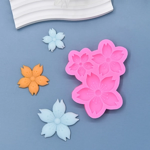Pink silicone mold with three cherry blossom sizes for fondant cake and chocolate baking