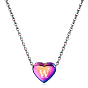 Detail of heart-shaped rainbow pendant with engraved letter W on a colorful chain