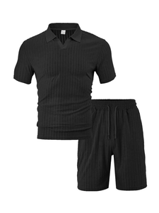 Detailed view of black ribbed texture fabric on men's casual shorts and polo shirt set