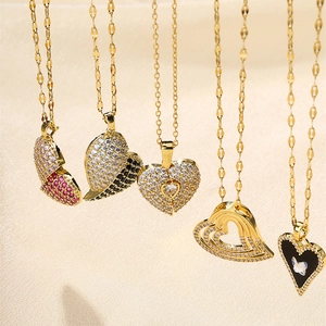Sparkling heart pendant necklaces set with pink and black zircon on gold-plated chains
