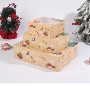 Three Christmas cupcake boxes with window display and festive holiday patterns
