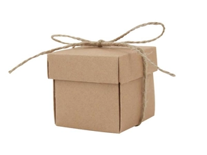 Detail of square kraft paper candy box with natural hemp rope bow on white background