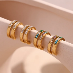 Macro detail of 18K gold plated double-layer C-shaped ear cuffs with colorful zircons