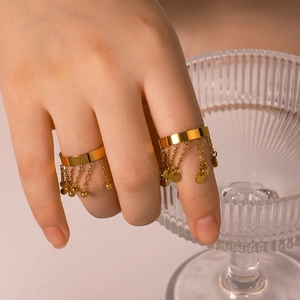 Golden stainless steel tassel open ring featuring delicate chain charms and beads for women