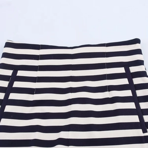 Close-up of black and white striped high waist shorts with detailed pocket stitching