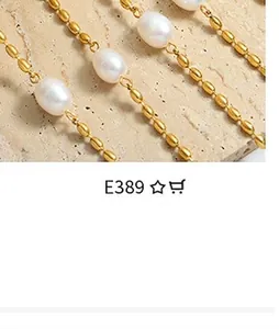 Detailed close-up of golden metal beads and white pearls on a textured stone surface