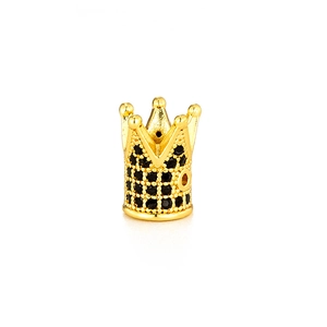 Close-up of golden crown bead with micro-paved black zircons for DIY jewelry making