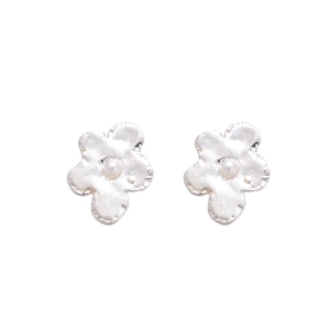 Elegant silver metal flower stud earrings with textured petals and center pearl