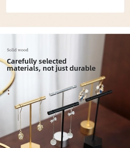 Detail of T-bar metal earring stands with solid wood bases in gold, silver and black