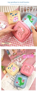 Close-up of portable cartoon sanitary napkin storage bags with zippers in multiple colors