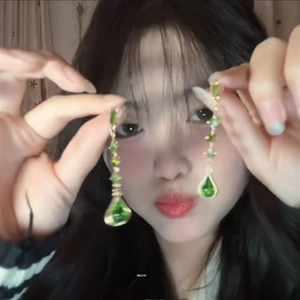 Sparkling green waterdrop tassel earrings with gold-tone finish for a sweet feminine style