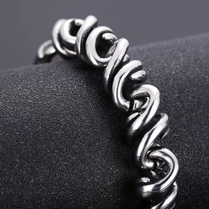 Detailed macro view of the twisted woven texture on this punk style steel bracelet