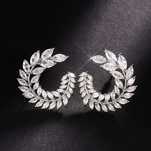 Exquisite silver-tone leaf stud earrings with marquise-cut zircons in a curved vine design