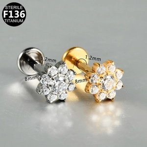 Detailed macro view of G23 titanium flower labret stud with 1.2mm gauge and 8mm length